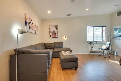 a living room with a couch and a table at 9 Mi to Airport WFH-Friendly Apt in Los Angeles! in Los Angeles