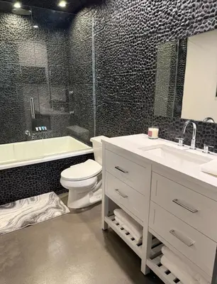 a bathroom with a toilet and a sink and a shower at Stylish Westwood Condo, Near UCLA & Century City in Los Angeles