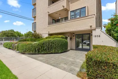a house with bushes in front of it at Stylish Westwood Condo, Near UCLA & Century City in Los Angeles