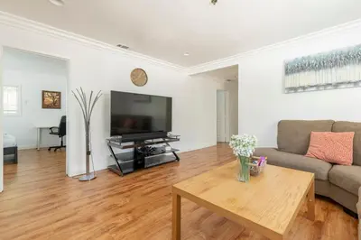 a living room with a couch and a table at Ideal 4BR2BA Home for Family Vacations in Alhambra