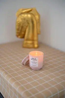 a candle sitting on top of a bathroom counter at Cozy 2BR2BA Guest House in Alhambra in Alhambra