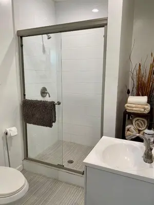 a bathroom with a shower with a sink and a toilet at Guest suite near La Cienega Park Beverly Hills next to LACMA La Brea Tar Pits Peterson Museum and Academy Awards Museum in Los Angeles