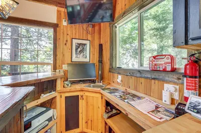 a kitchen with a desk with a computer in it at 3 Mi to Lake Arrowhead Village Dog-Friendly Cabin in Lake Arrowhead