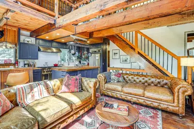 a living room with two couches and a table at 3 Mi to Lake Arrowhead Village Dog-Friendly Cabin in Lake Arrowhead