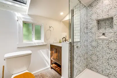 a bathroom with a toilet and a shower at 3 Mi to Lake Arrowhead Village Dog-Friendly Cabin in Lake Arrowhead