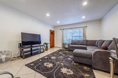 a living room with a couch and a flat screen tv at Amazing Berryman 1bd#8 in Los Angeles