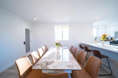 a dining room with a table and chairs at Modern Private Ensuite Room near USC in Los Angeles