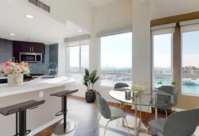 a kitchen and dining room with a table and chairs at Marina Escape 2BR Townhouse with FREE PARKING in Los Angeles