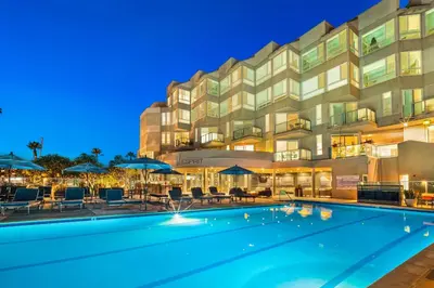a swimming pool in front of a hotel at night at Marina Escape 2BR Townhouse with FREE PARKING in Los Angeles