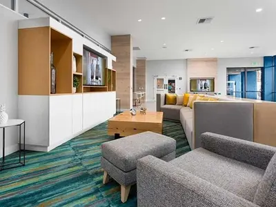 a living room with a couch and chairs and a table at Blueground Hollywood Hills jacuzzi nr Runyon Canyon LAX-1380 in Los Angeles