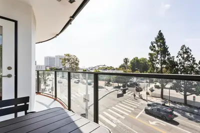 an apartment balcony with a view of a street at Blueground Sawtelle rooftop nr Culver City Park LAX-1373 in Los Angeles