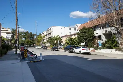 a street with cars parked on the side of the road at Blueground Sawtelle rooftop nr Culver City Park LAX-1373 in Los Angeles