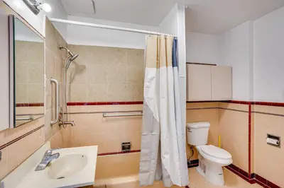 a bathroom with a toilet and a sink and a shower at 3 Mi to Beaches Low-Key San Pedro Rental! in San Pedro