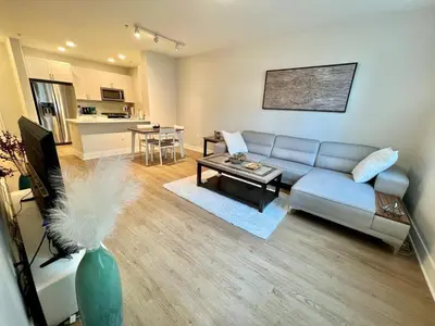a living room with a couch and a table at Miracle Mile Apartments in Los Angeles