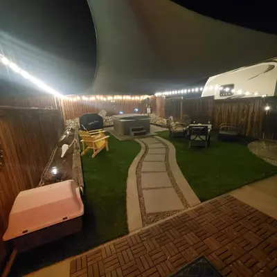 a backyard with a garden with a table and chairs at Star Gazer's Paradise in Apple Valley