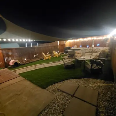 a room with a yard with a table and chairs at Star Gazer's Paradise in Apple Valley