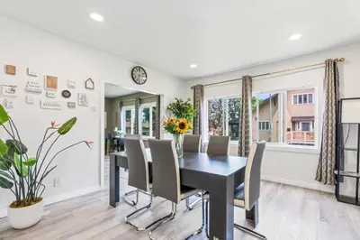 a dining room with a black table and chairs at Prime location King Bed! Private house1 in Alhambra