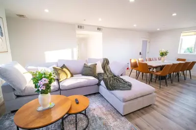 a living room with a couch and a table at The Command Suite Urban Comfort Near USC in Los Angeles