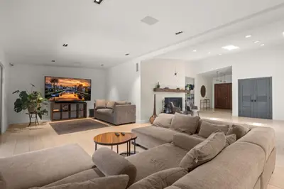a large living room with a couch and a table at The Royer Retreat With Pool and Hot tub in Los Angeles