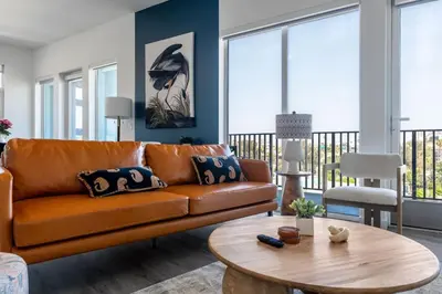 a living room with a couch and a table at Skyline Haven Near Dodger Stadium with Views in Los Angeles