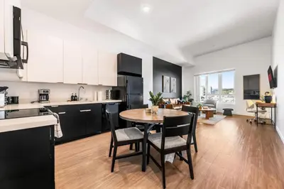 a kitchen and dining room with a table and chairs at Central LA Hideaway, Steps from Japanese Village in Los Angeles
