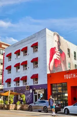 a building with a large advertisement on the side of it at 2BD 2BA Stylish Arts District Retreat, Walk to Little Tokyo in Los Angeles