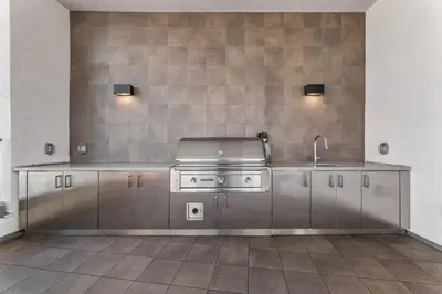a kitchen with a stove and a sink at Modern Studio Retreat in the Heart of Art District in Los Angeles