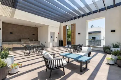 a patio with a table and chairs at Stylish 2BD Haven with Scenic DTLA Views and Parking in Los Angeles