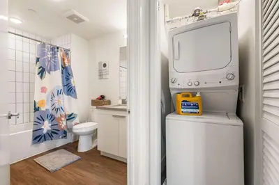 a bathroom with a toilet and a tv on top at Stylish 2BD Haven with Scenic DTLA Views and Parking in Los Angeles