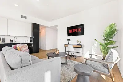 a living room with a couch and a table at Spacious 1-BD with Stunning City Views in DTLA in Los Angeles