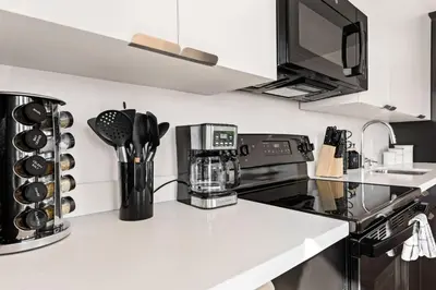 a kitchen with a counter top with a coffee maker at Spacious 1-BD with Stunning City Views in DTLA in Los Angeles
