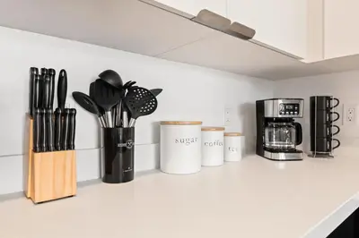 a kitchen counter with various utensils on it at Spacious 1-Bedroom Gem with Downtown LA Views in Los Angeles