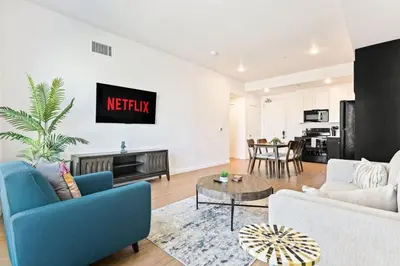 a living room with a couch and a table at Designer Stay in Arts District, Walk to Little Tokyo in Los Angeles
