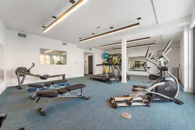 a gym with several exercise bikes in a room at Chic and Cozy Home, Walk to Little Tokyo with Parking in Los Angeles