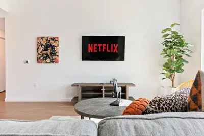 a living room with a couch and a table at Little Tokyo Gem, Steps from Shops with Free Parking in Los Angeles