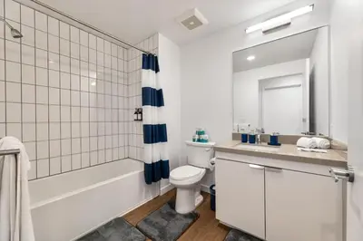 a bathroom with a tub and a toilet and a sink at Little Tokyo Gem, Steps from Shops with Free Parking in Los Angeles