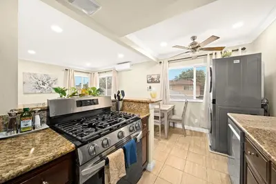 a kitchen with a stove and a counter top at Vibrant & Refreshing - 12 min to Downtown LA in Alhambra