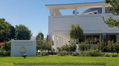 a large building with a sign in front of it at Vibrant & Refreshing - 12 min to Downtown LA in Alhambra