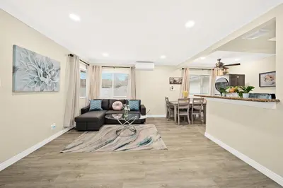 a living room with a couch and a table at Vibrant & Refreshing - 12 min to Downtown LA in Alhambra