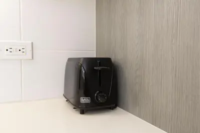 a black appliance sitting on the corner of a wall at Walk to Santa Monica Beach Pier Boardwalk Venice in Los Angeles