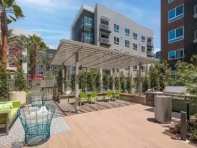 a patio with tables and chairs under a canopy at Cozy 2bd Apt Near Disneyland Anaheim Conv Center in Anaheim