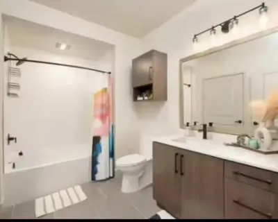 a bathroom with a shower and a toilet and a sink at Cozy 2bd Apt Near Disneyland Anaheim Conv Center in Anaheim
