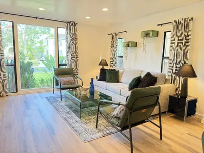 a living room with a couch and two chairs at Modern Duplex with 6 beds and Sofa bed in Miracle Mile Longwood in Los Angeles