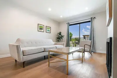 a living room with a couch and a table at Stylish 1BR Near Universal Studios with Parking in Los Angeles