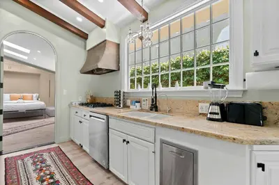 a kitchen with a sink and a window at New Listing Marina Villa by Colby & Conrad in Los Angeles