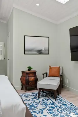 a bedroom with a bed and a chair and a table at New Listing Marina Villa by Colby & Conrad in Los Angeles