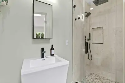 a white bathroom with a sink and a shower at New Listing Marina Villa by Colby & Conrad in Los Angeles