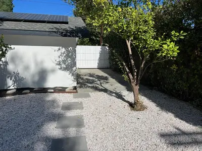 a tree in the middle of a gravel yard at Brand new private one bed one bath home with private parking for 2 in Van Nuys Airport