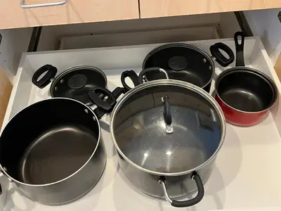 a stove top with pots and pans on it at Brand new private one bed one bath home with private parking for 2 in Van Nuys Airport