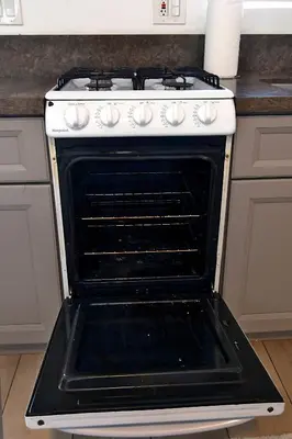 an oven with its door open in a kitchen at Urban Oasis in Los Angeles